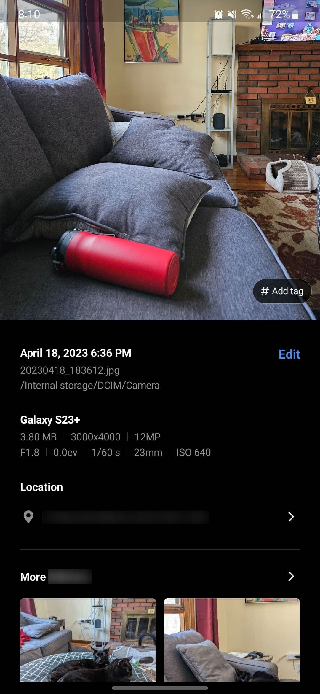 Viewing the exif data of a photo of a red water bottle on a blue couch in Samsung Gallery