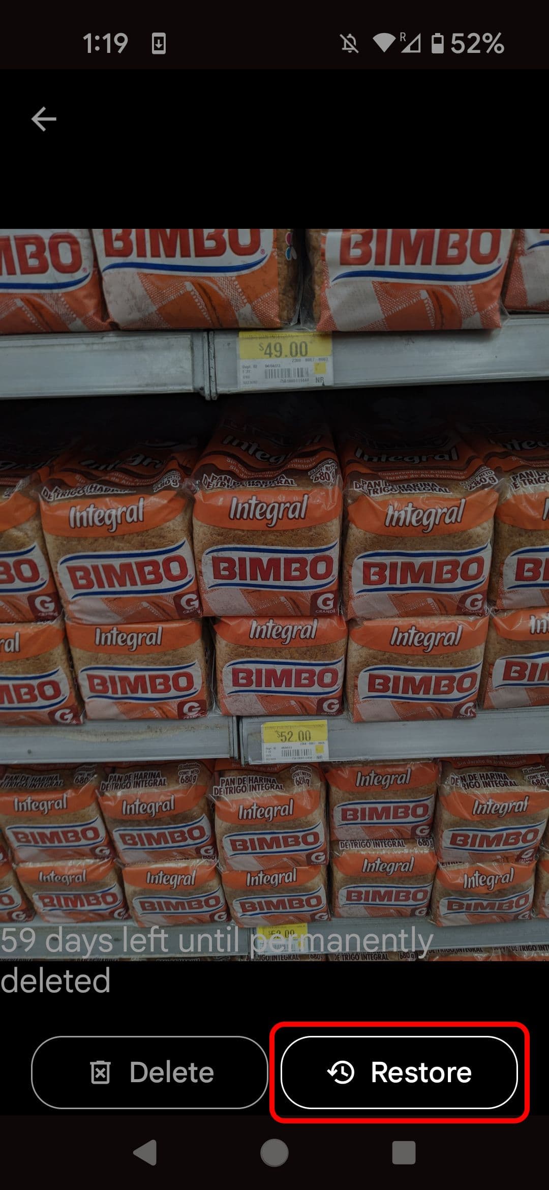 Google Photos deleted image highlighting the Restore button