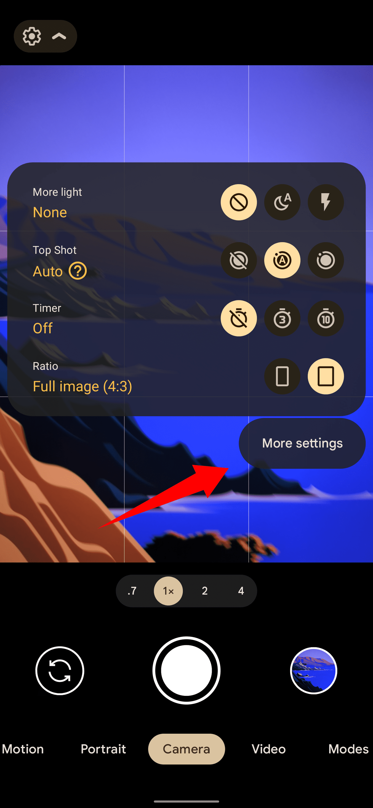 A screenshot of the camera app on a Pixel phone, with an arrow pointing to the 'More settings' button.