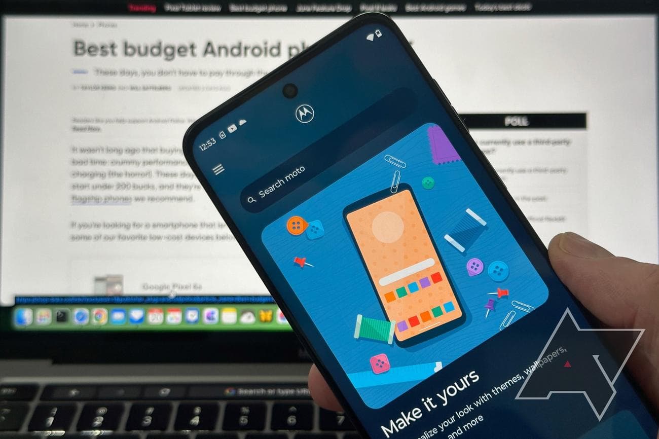 Moto-G-Stylus-5G-held-in-front-of-laptop