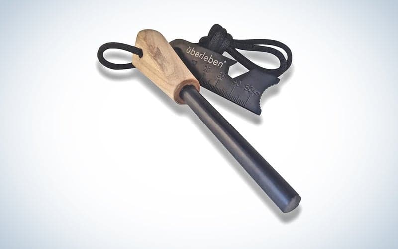 An Ã¼berleben ZÃ¼nden Fire Starter on a blue and white background