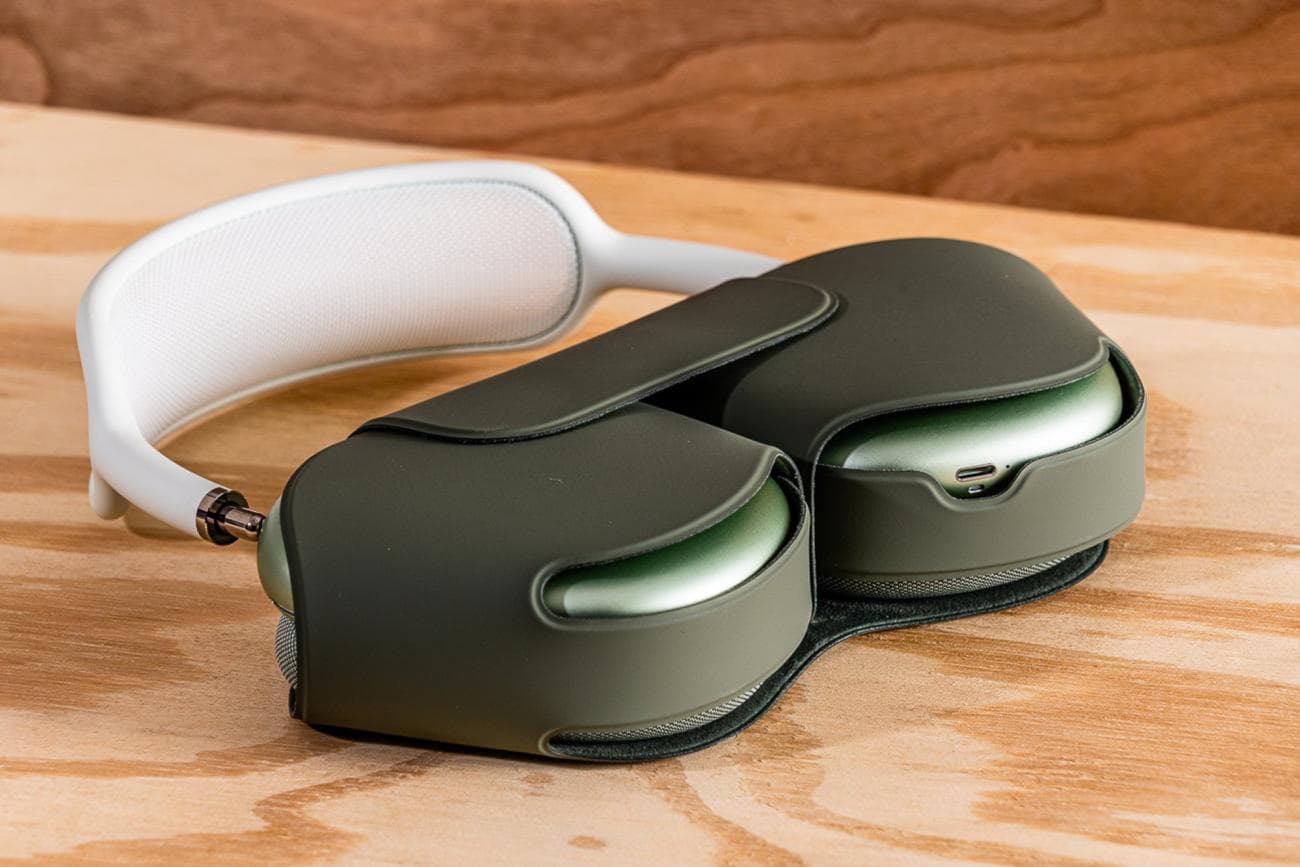 The Apple AirPods Max headphones in their gray, wraparound Smart Case.