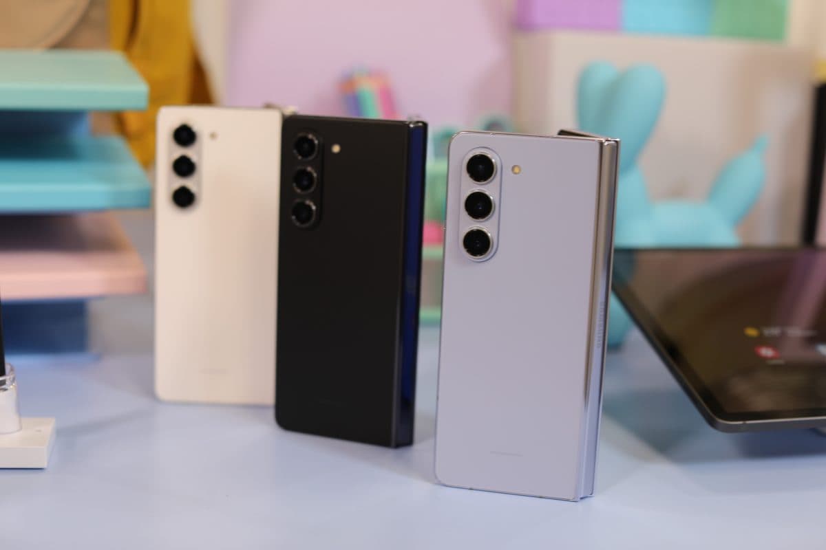 samsung galaxy z fold 5 in three colors from left to right; white, black and silver