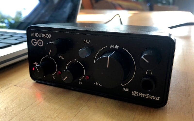 PreSonus AudioBox GO interface sitting next to a MacBook