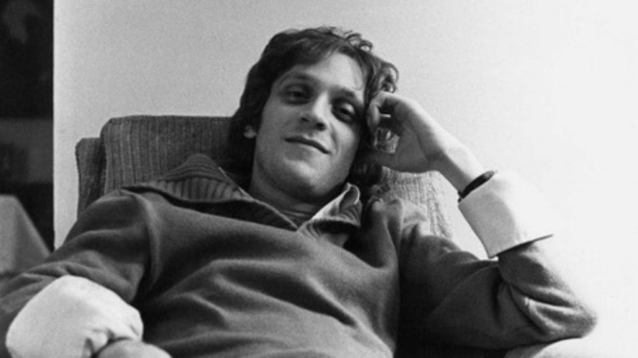 A black and white photo of composer Howard Ashman