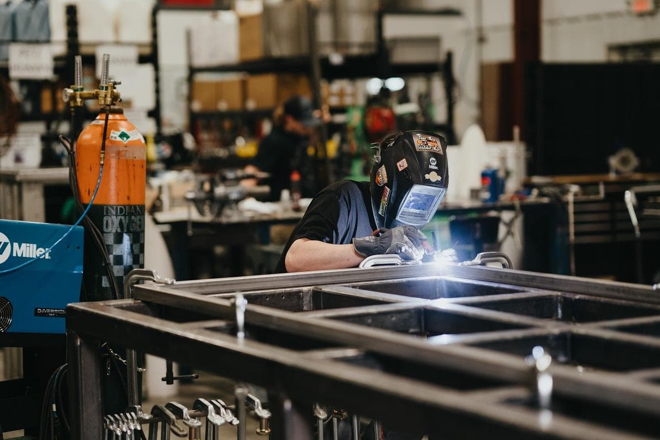 A welder at the Bio-Response Solutions warehouse