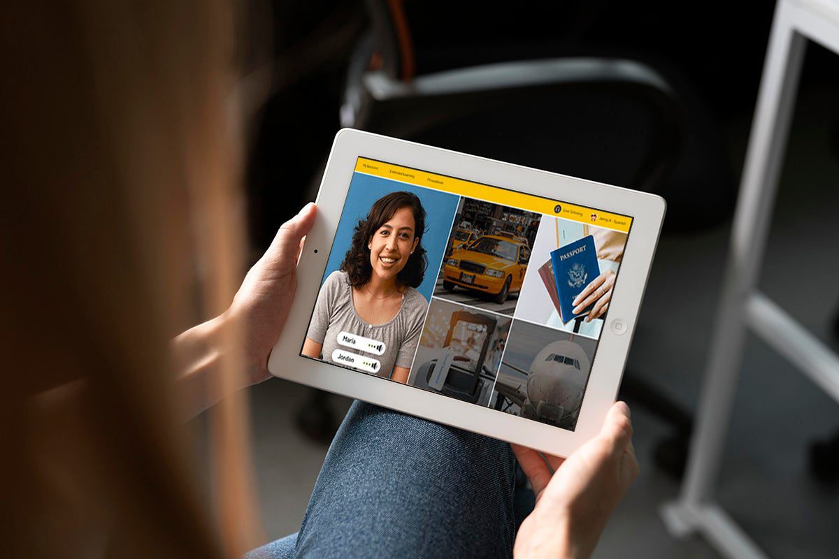 A person using an iPad with Rosetta Stone loaded on it