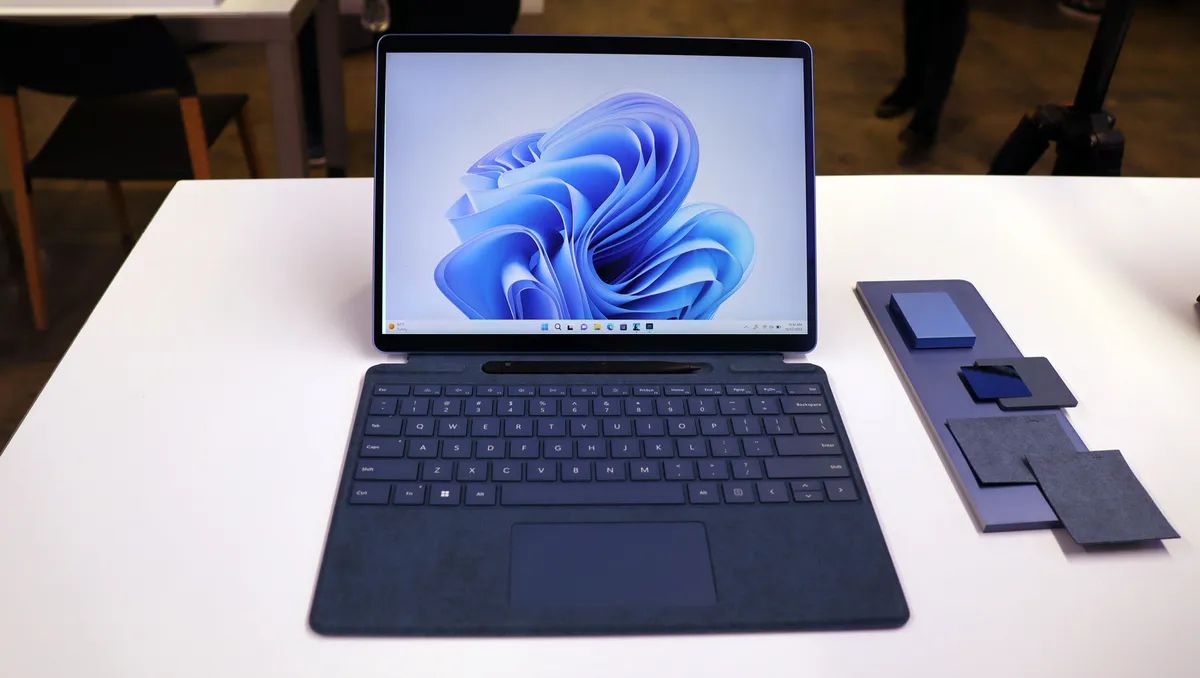 A Microsoft Surface Pro 9 on a whte table