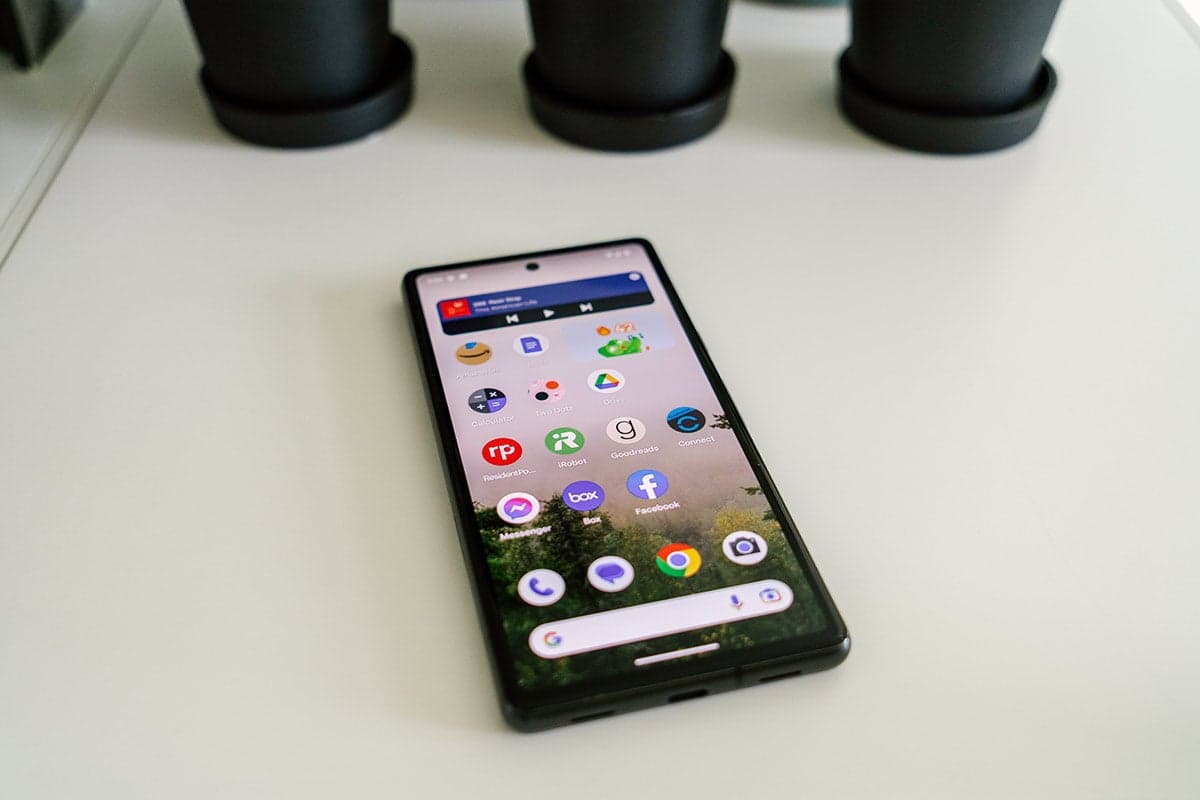 Google Pixel 7a on a white shelf