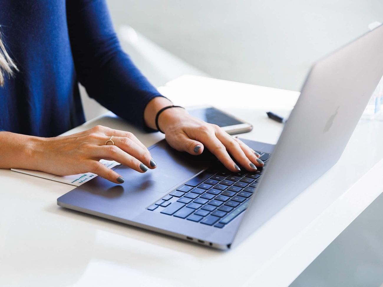 Person working on laptop computer, probably enabling Chrome flags