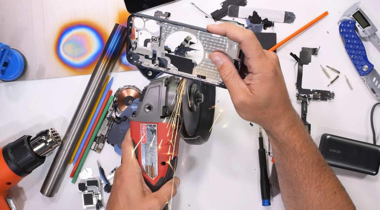 iPhone 15 Pro Max ripped in half by an angle grinder