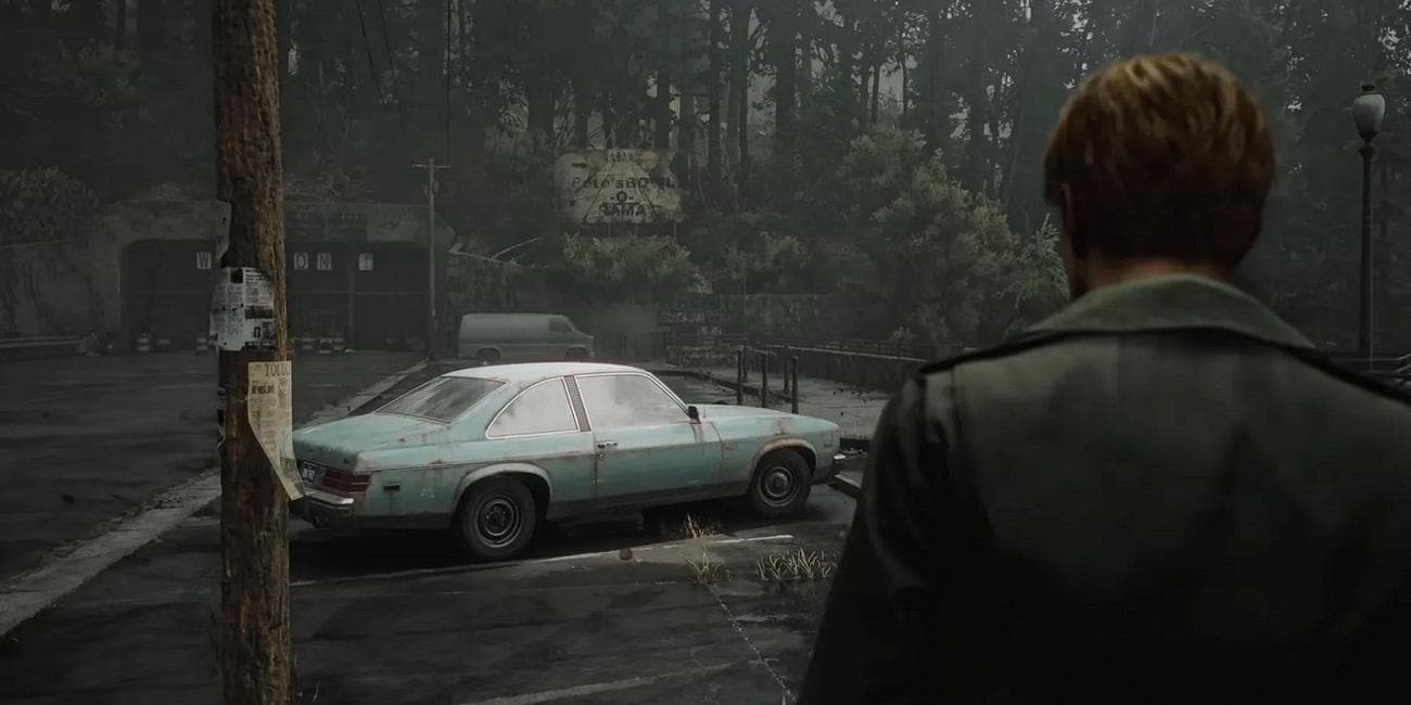 Image from the Silent Hill 2 remake showing James Sunderland looking at a rusty old car.