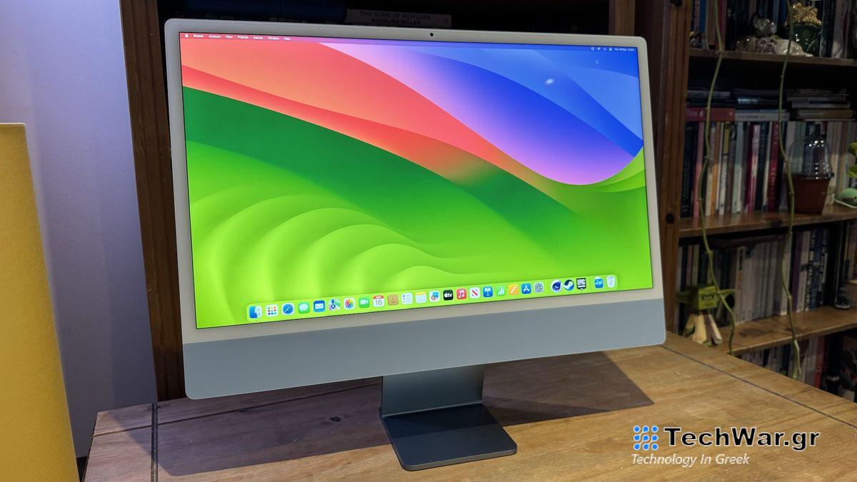The 2023 M3 iMac on a wooden desk, showing the features of macOS Sonoma