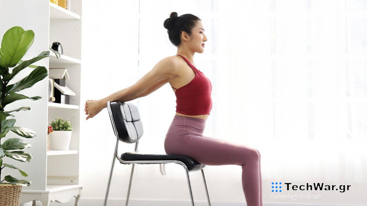 a photo of a woman stretching in a chair