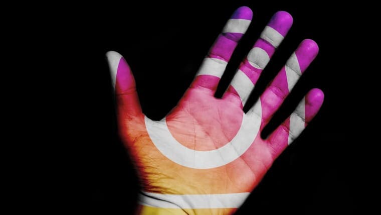 Instagram logo projected on a hand