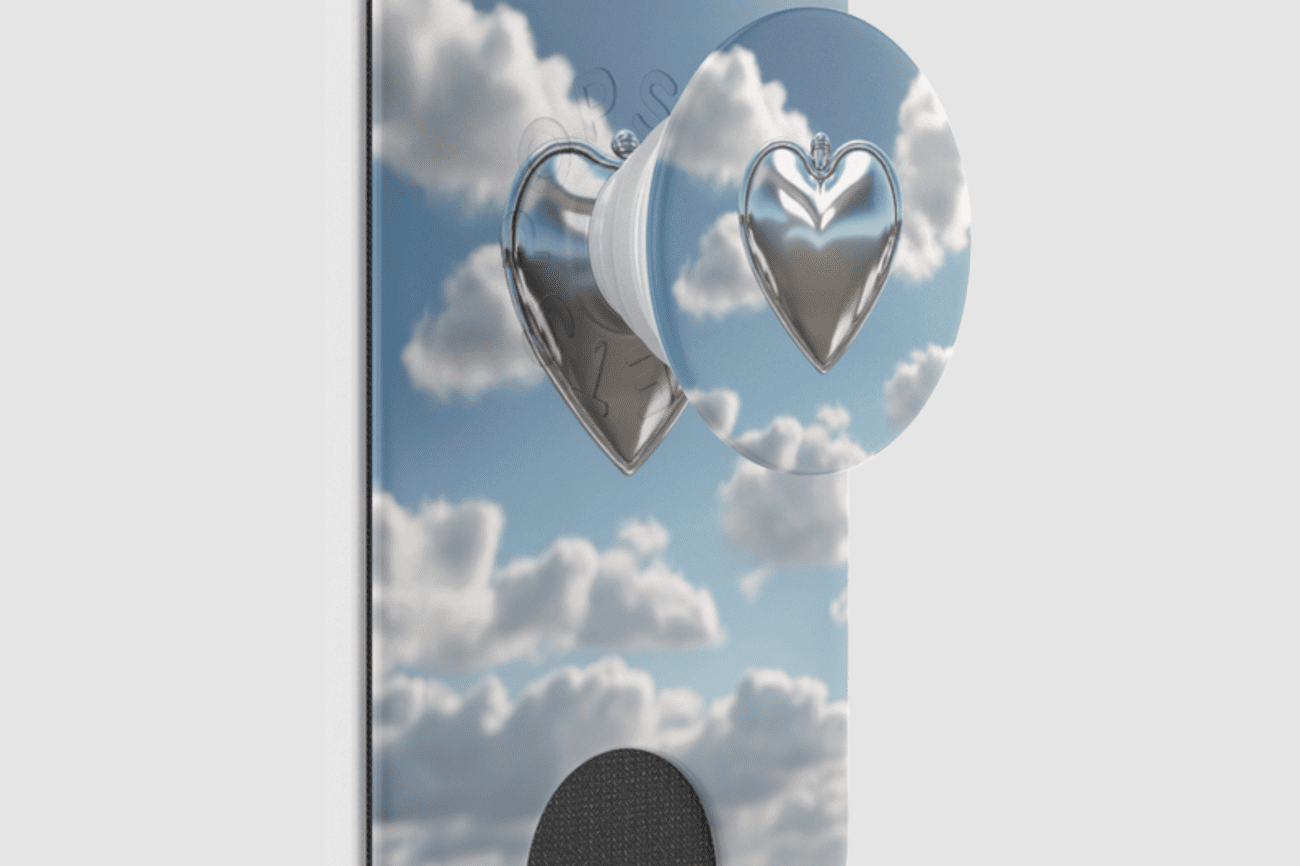 Popsocket attached to case / wallet decorated with a sky scene.