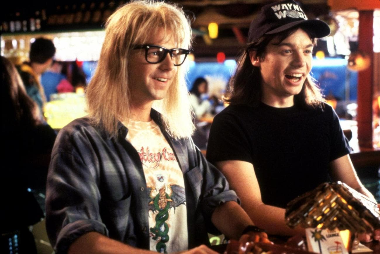 Garth and Wayne smile and look at something in the distance.