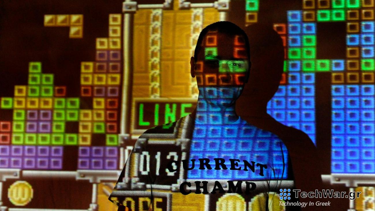 Vinnie Parenti flaunts his talent wearing a t-shirt reading "Current Champ." Tetris fanatics meet every month for intense head-to-head competition in a double-elimination tournament format.