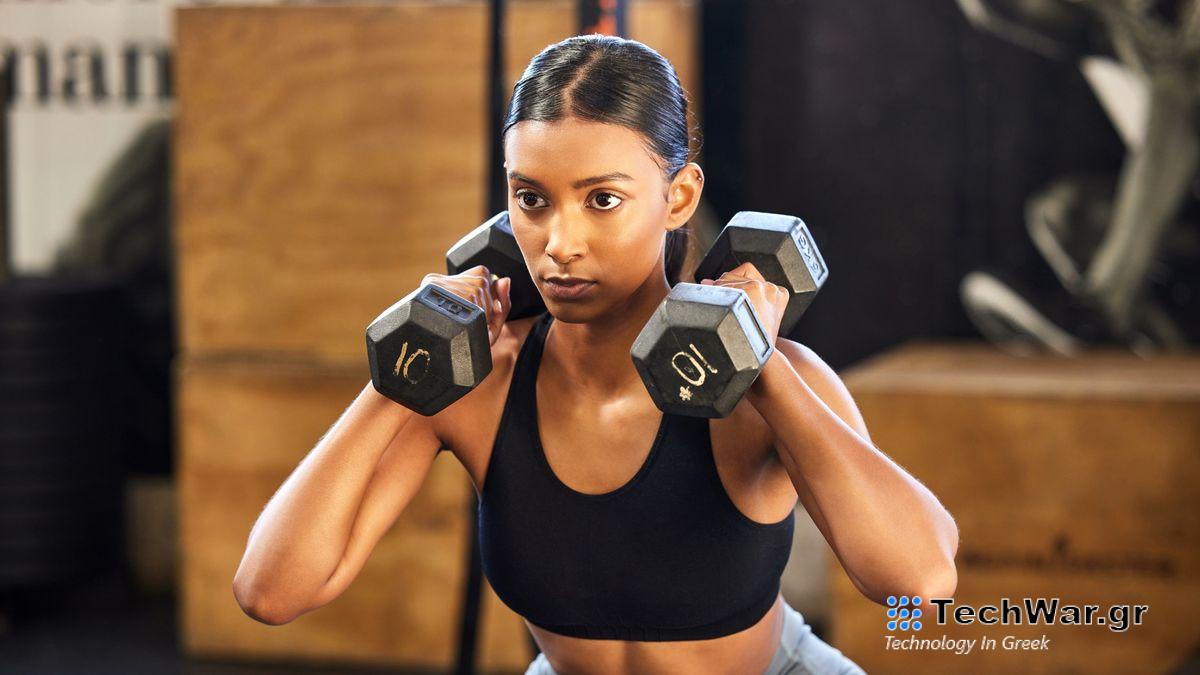 a photo of a woman holding two dumbbells