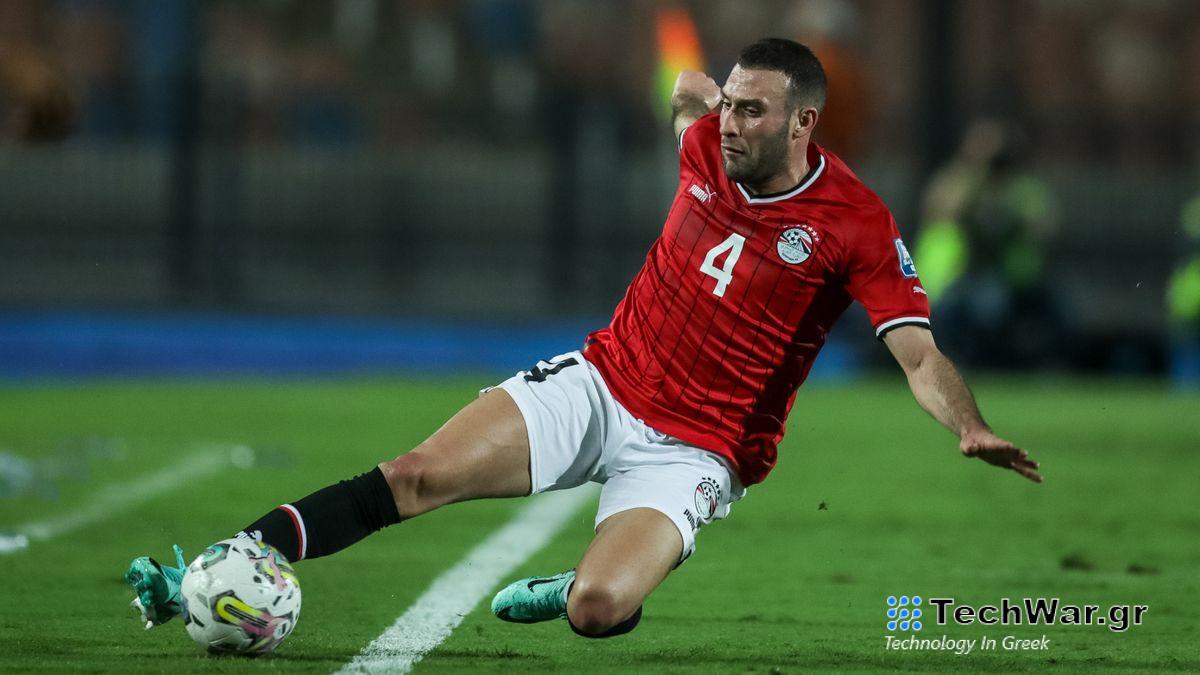 Omar Kamal of Egypt slides towards the ball on a green soccer pitch ahead of the AFCON Egypt vs Mozambique live stream. 