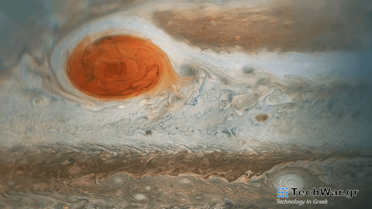 Jupiter’s iconic Great Red Spot and the surrounding turbulent zones, shown in shades of white and brown.