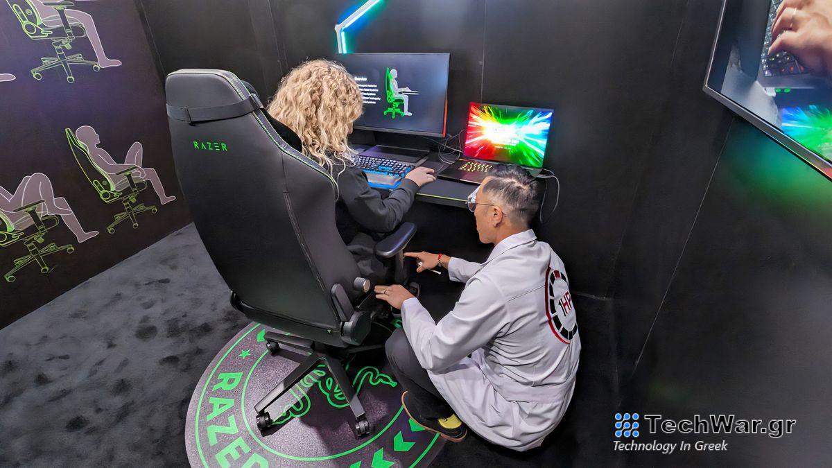 Dr. Matthew Hwu of 1HP explains personal gaming chair measurements to Rebecca Spear.