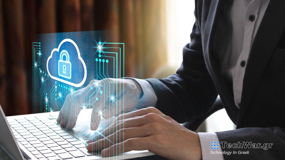 A person at a laptop with a cybersecure lock symbol floating above it.