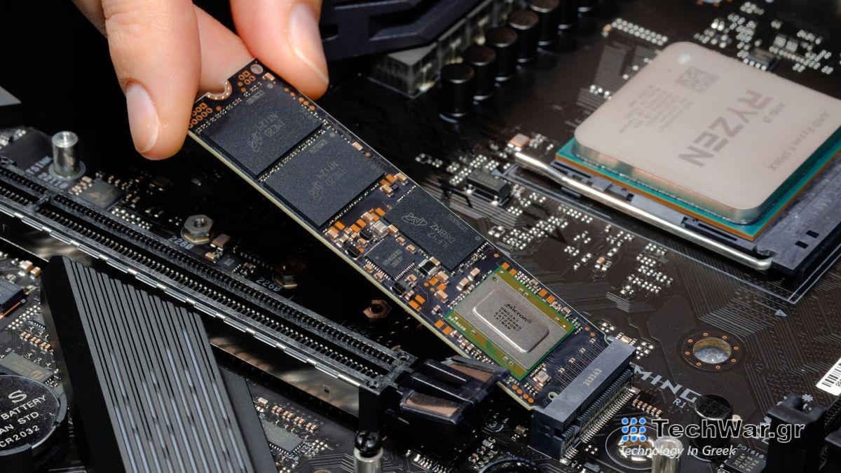 fingers holding a dismantled ssd card