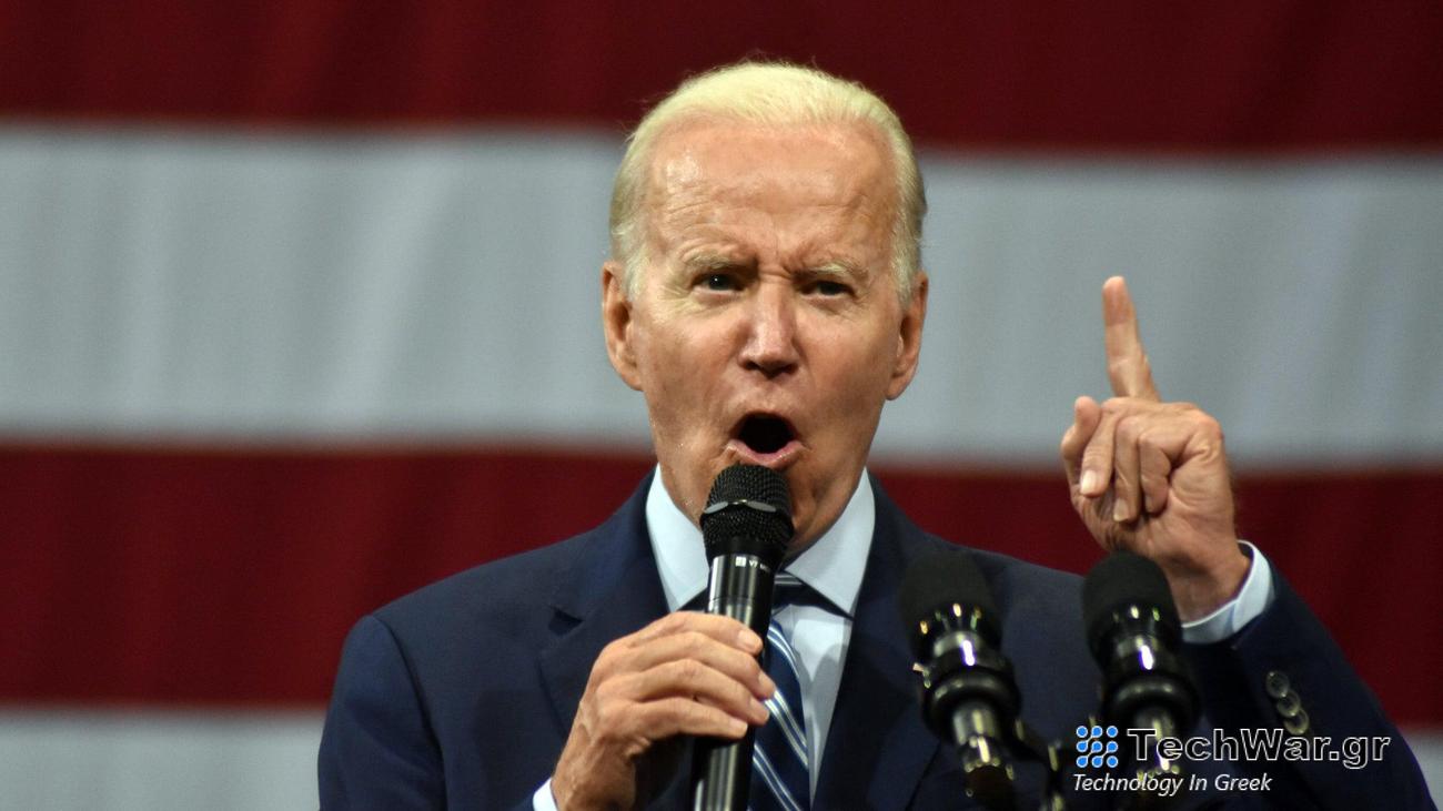 Joe Biden speaking in front of American flag