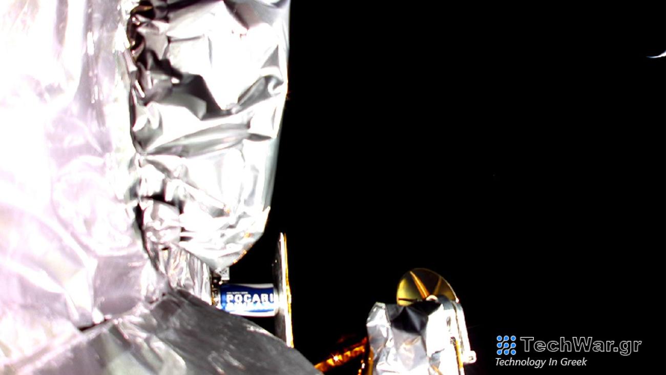 An image taken by a camera aboard the Peregrine spacecraft, with Earth in the top right.