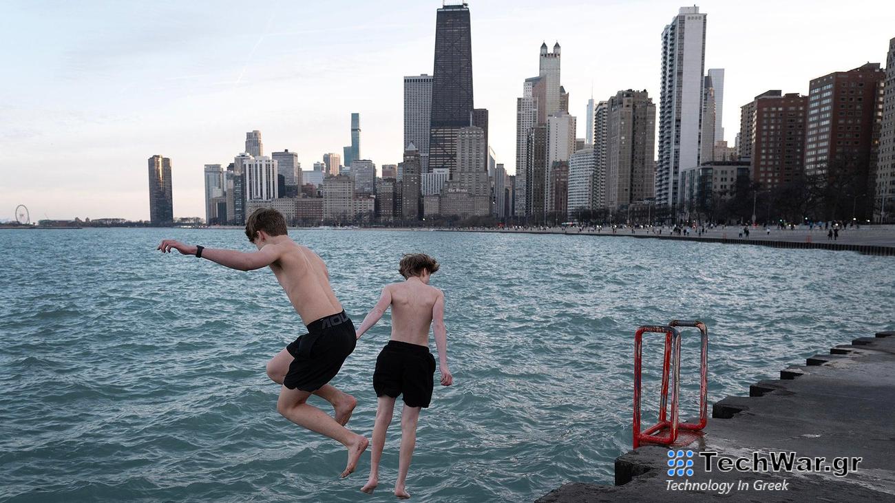 Ryan Ahmadian and Mack Brusznicki jump into Lake Michigan as temperatures climbed to 71 degrees on February 26, 2024 in Chicago, Illinois. The unusually warm day broke a previous high record of 64 degrees, set in 2000. Snow is expected on Wednesday. 
