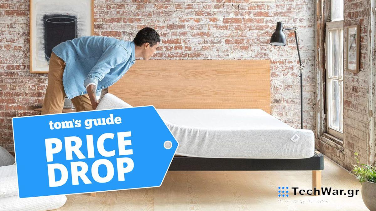 Man adjusting the Tuft and Needle Nod mattress on a base