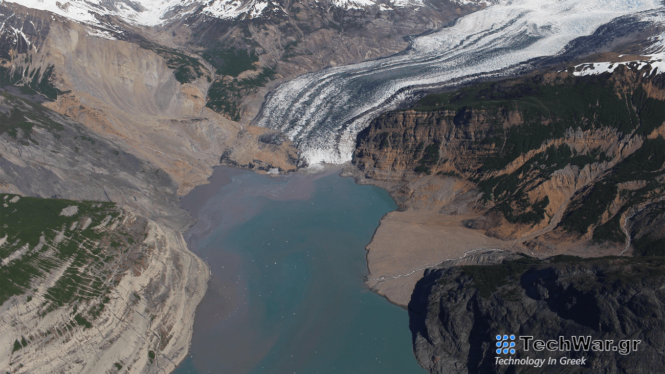 A photograph taken in the spring of 2016 of the debris field from an October 2015 landslide extends over the toe of the Tyndall Glacier and into Taan Fjord.