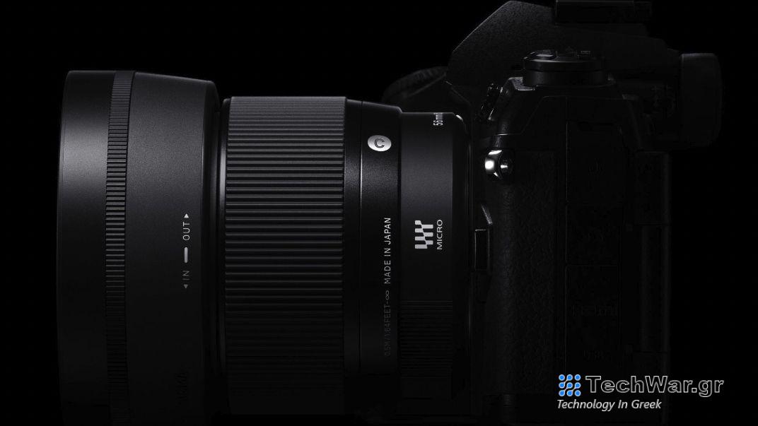 Sigma 56mm f/1.4 contemporary lens attached to a Nikon mirrorless camera, black background