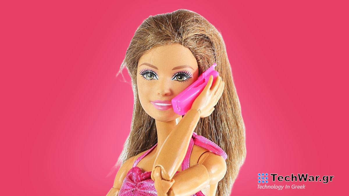 A barbie doll using an iPhone