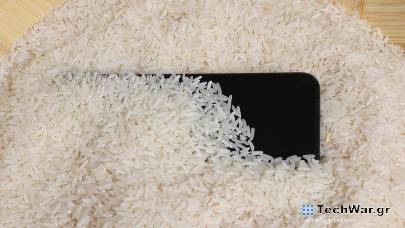 iPhone submerged in white rice