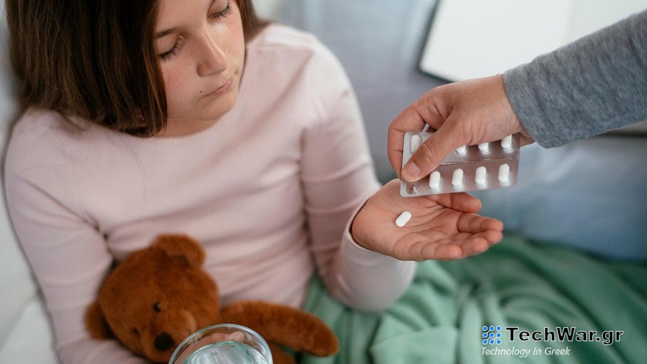Child getting medicine from parent