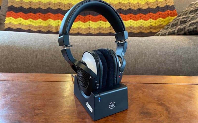 The Yamaha YH-WL500 wireless musicians headphone on a table in front of a colorful blanket