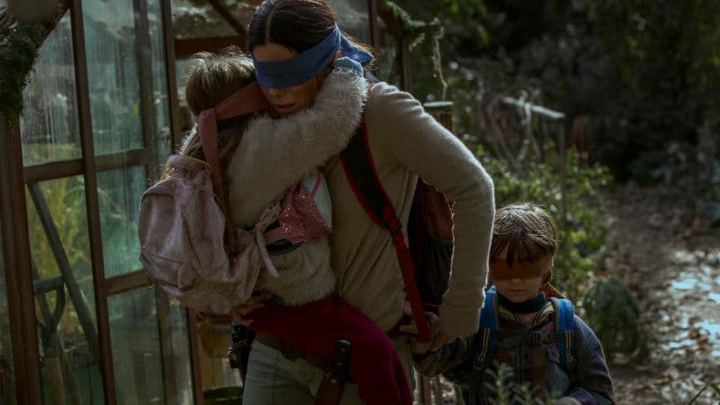 Vivien Lyra Blair, Sandra Bullock, Julian Edwards in Bird Box airs on Netflix December 21, 2018