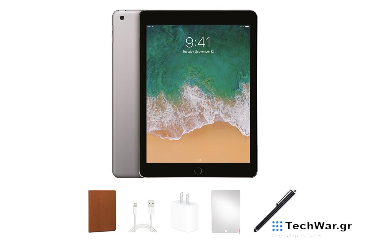 A silver refurbished Apple iPad with accessories on a white background.