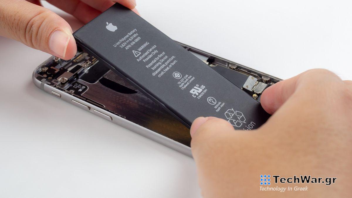 Close-up image of Technician hands tried to remove, take of, change or replace Apple iPhone 6 battery degenerate or damage.