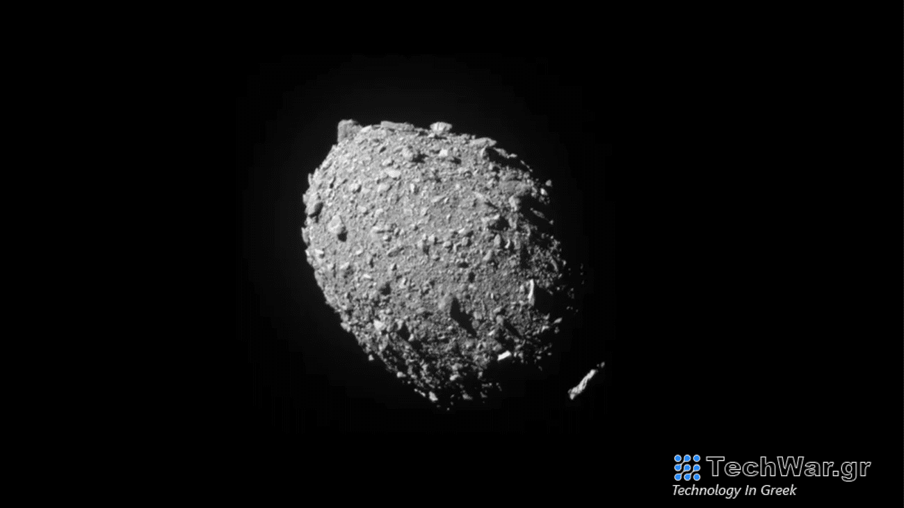 A circular asteroid with a smaller rock orbiting it. The asteroid Dimorphos was captured by NASA’s DART mission just two seconds before the spacecraft struck its surface on September 26, 2022.