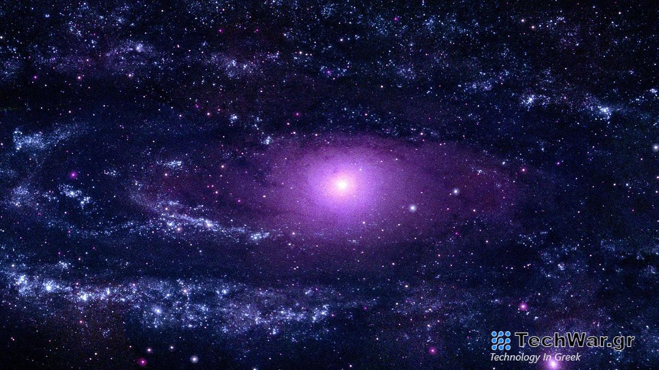 a swirling, purple galaxy in space